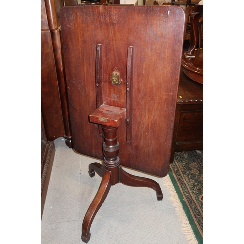 510 - An early 19th century mahogany rectangular tilt top table, on vase turned column and tripod splay su... 