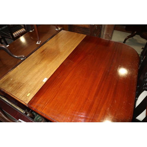 512 - A 19th century mahogany deep drop leaf dining table, on square taper supports with ceramic castors, ... 