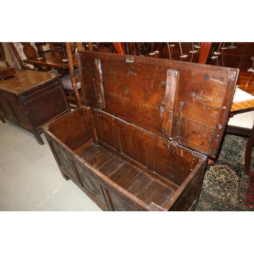 543 - An antique oak three panel front coffer, on moulded stile supports