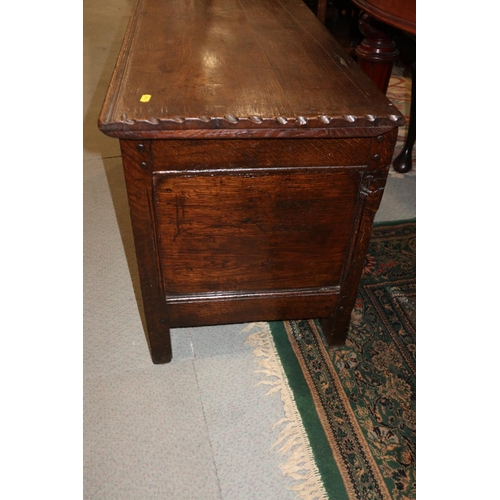 543 - An antique oak three panel front coffer, on moulded stile supports