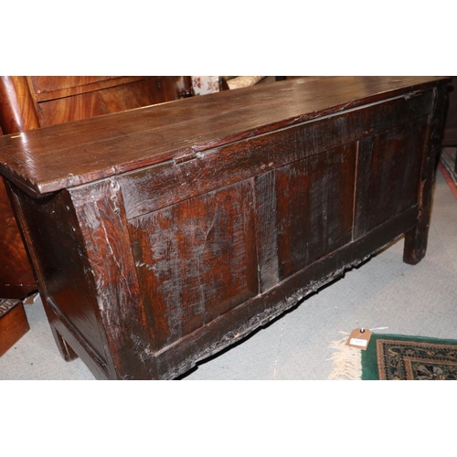 543 - An antique oak three panel front coffer, on moulded stile supports