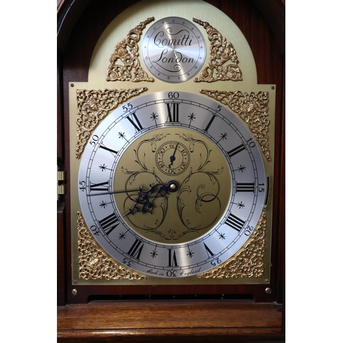 552 - A mahogany long case clock with striking and chiming three train movement by Comitti, 74 1/2