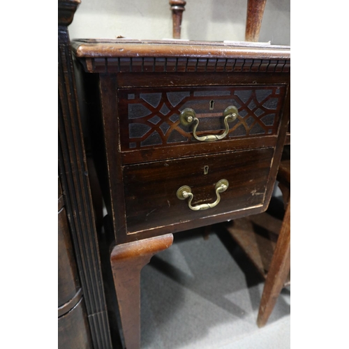 640 - An Edwardian mahogany writing table with faux leather top, fitted blind fretted drawers and two furt... 