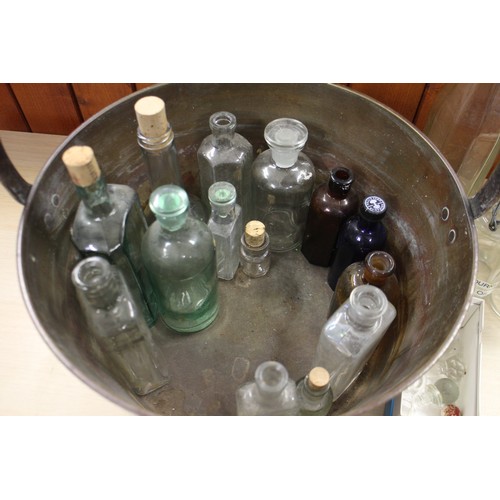 66 - A collection of glass bottles, various, a clear cut glass ceiling light shade, a similar alabaster s... 