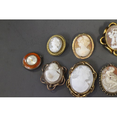 388 - A 19th century yellow metal framed carved shell cameo, ten other cameos and an enamelled watch