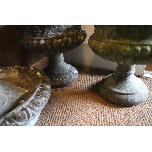 647 - A number of cast stone garden urns