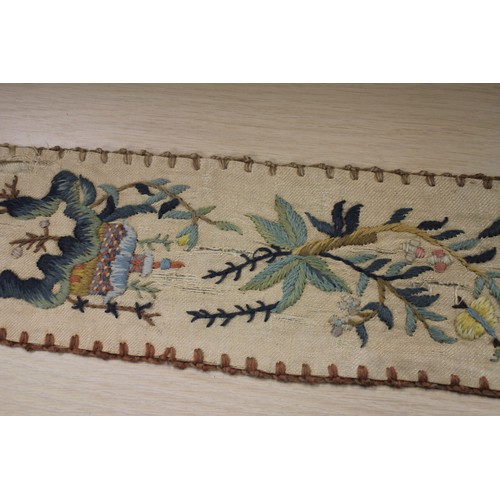 191 - A 19th century crewel work bell pull with floral and tree designs, 80