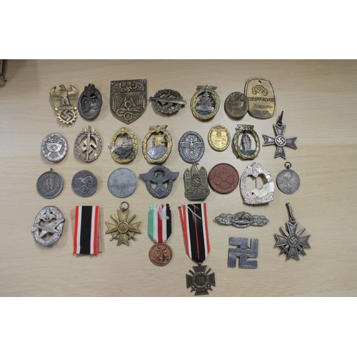 387 - A quantity of Nazi medals and badges, including a Kriegsmarine Destroyer Navy badge, a War Merit Cro... 