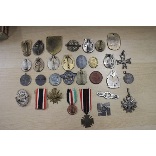 387 - A quantity of Nazi medals and badges, including a Kriegsmarine Destroyer Navy badge, a War Merit Cro... 