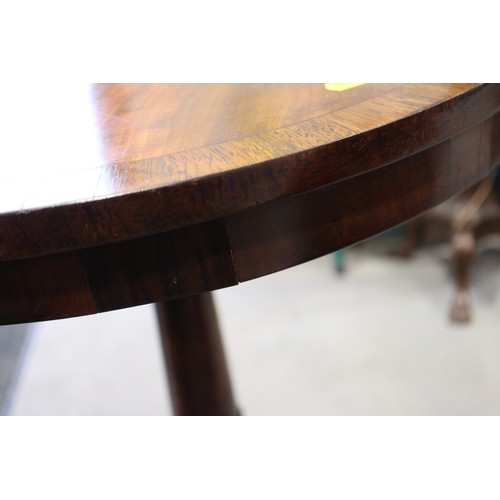 520 - An early 19th century mahogany and rosewood banded circular top occasional table, on carved column a... 