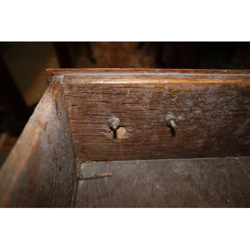 486 - A late 18th century oak dresser, the upper section with open plate shelves over three drawers with b... 