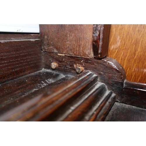 486 - A late 18th century oak dresser, the upper section with open plate shelves over three drawers with b... 