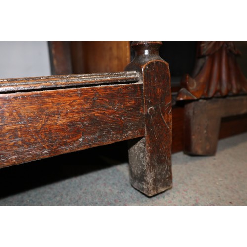 486 - A late 18th century oak dresser, the upper section with open plate shelves over three drawers with b... 