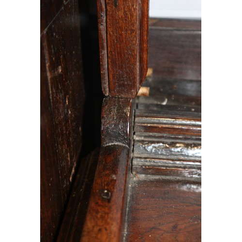 486 - A late 18th century oak dresser, the upper section with open plate shelves over three drawers with b... 