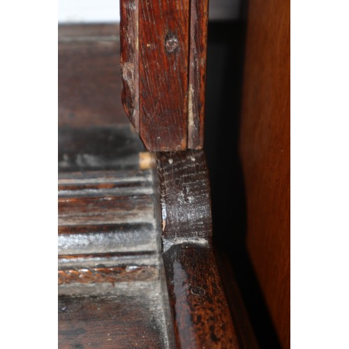 486 - A late 18th century oak dresser, the upper section with open plate shelves over three drawers with b... 