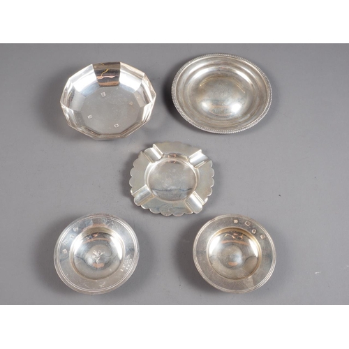 361 - Two silver armada dishes, a silver pin dish, a faceted dish and a silver ashtray, 9.9oz troy approx