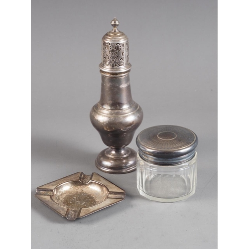 366 - A silver sugar caster, a silver ashtray and a silver topped dressing table jar, 4.6oz troy approx we... 