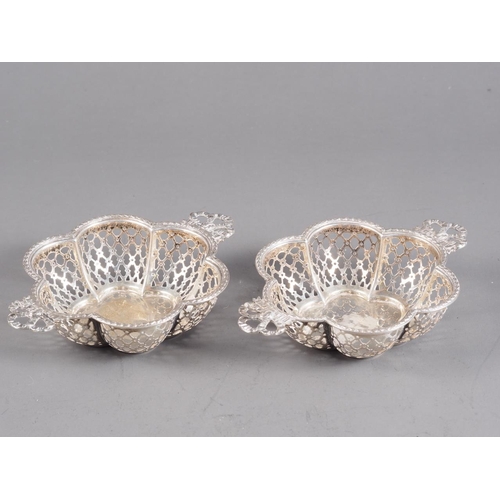 372 - A pair of silver sweet meat baskets with pierced decoration and ribbon handles, 3.2oz troy approx