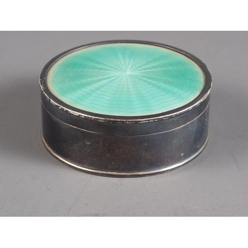 375 - A circular silver hinged box with turquoise guilloche enamel top, 4.6oz troy approx