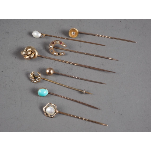 387 - Eight Victorian gold and yellow metal stick pins, various