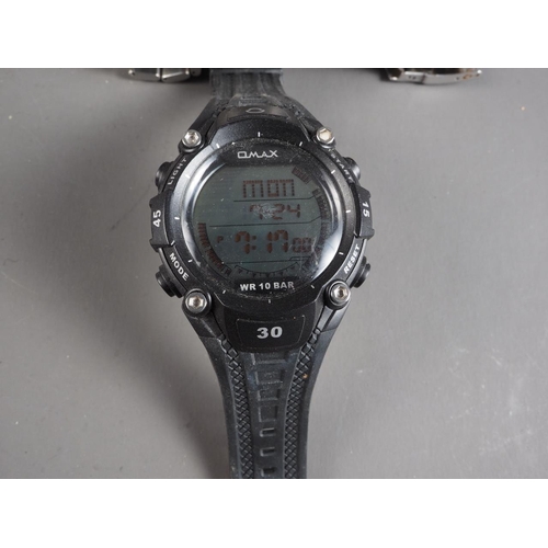 433 - A Rip Curl Ocean Tide watch, a G Max quartz watch and three other watches