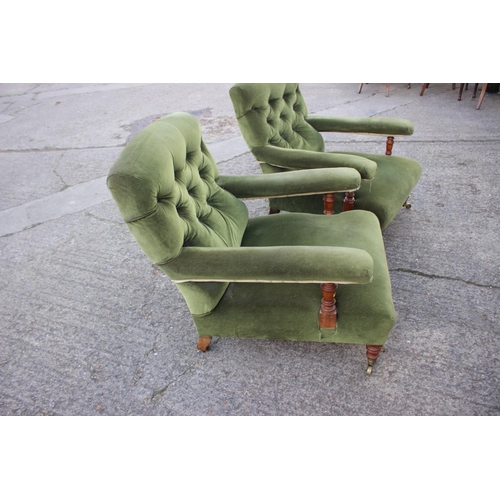 540 - A pair of Victorian oak framed armchairs, upholstered in a green velour, on turned and brass castore... 