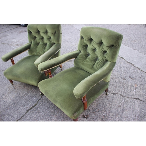 540 - A pair of Victorian oak framed armchairs, upholstered in a green velour, on turned and brass castore... 