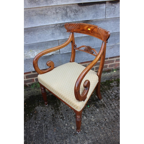 543 - A Regency carved mahogany bar back carver chair, on turned reeded supports