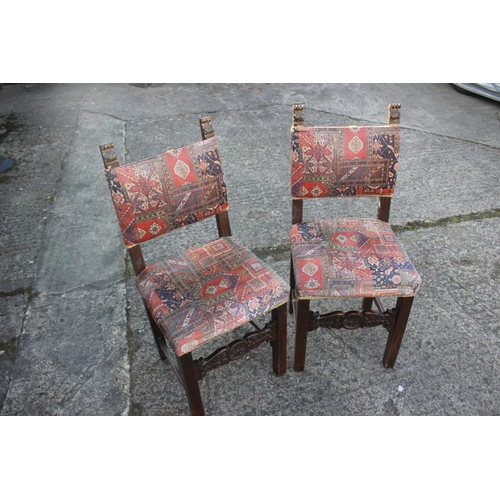 544 - A pair of late 17th century Continental walnut side chairs with padded seats and backs, upholstered ... 