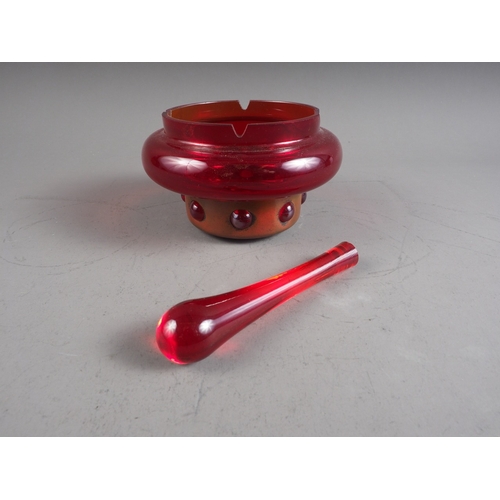 10 - A ruby glass pestle and mortar, 5 1/2