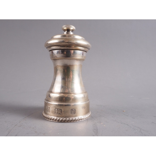 376 - A silver pepper mill, 4