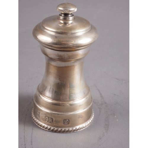 376 - A silver pepper mill, 4