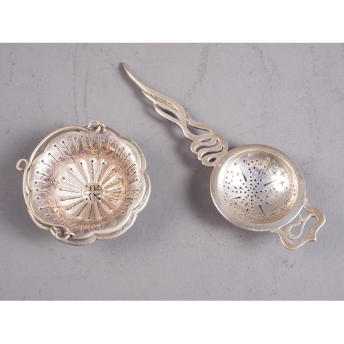 380 - A silver tea strainer with pierced handle and one other tea strainer, 1.8oz troy approx