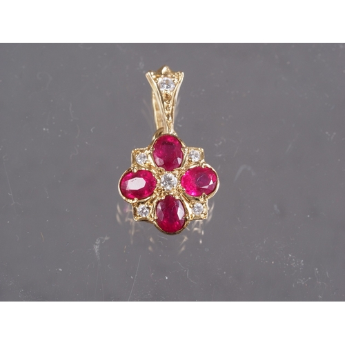 389 - A 9ct gold, diamond and ruby pendant, 1.1g