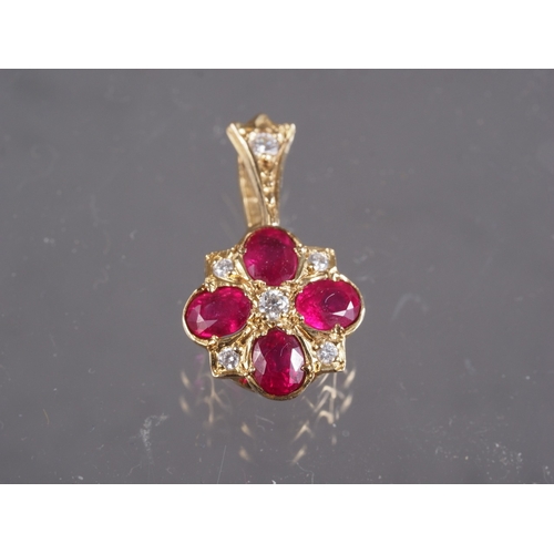 389 - A 9ct gold, diamond and ruby pendant, 1.1g