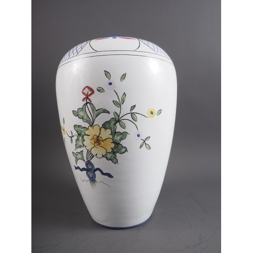 4 - A Portuguese faience vase with floral decoration, base marked 