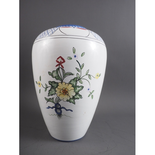 4 - A Portuguese faience vase with floral decoration, base marked 