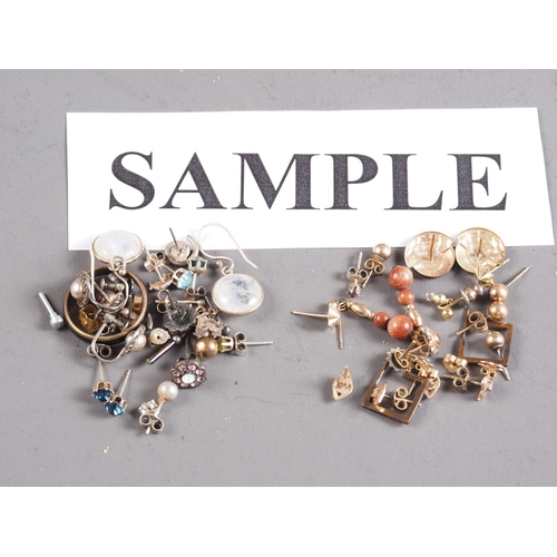 403 - A collection of yellow metal and other ear studs, including pearl, moonstone, etc