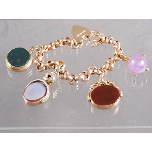 413 - A 9ct gold bracelet, set three hardstone seals and an amethyst in eagle claw setting, 44.7g gross