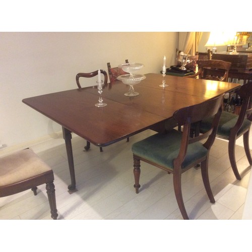 541 - A George III mahogany deep drop leaf dining table, on turned supports and pad feet, 48