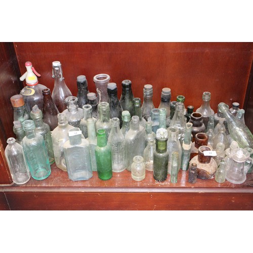 31 - A quantity of stoneware and glass bottles, variousTallest is 10 1/2