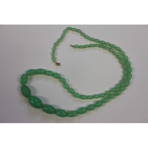 388 - A string of cherry amber Bakelite graduated oval beads, largest 29mm wide, 61g, and a jade coloured ... 