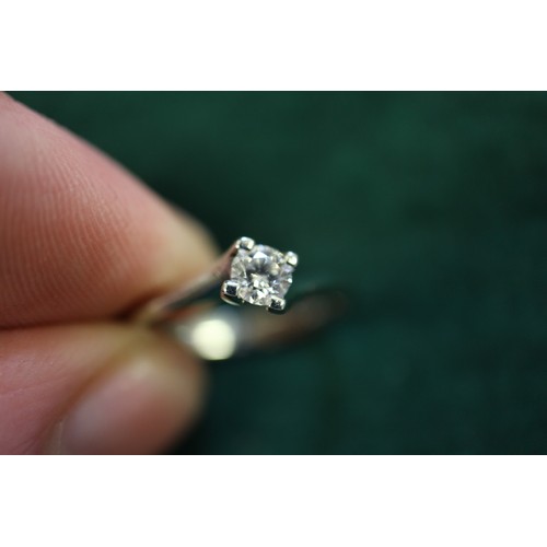 391 - A platinum and diamond solitaire ring, 0.2cts approx, size K, 3g