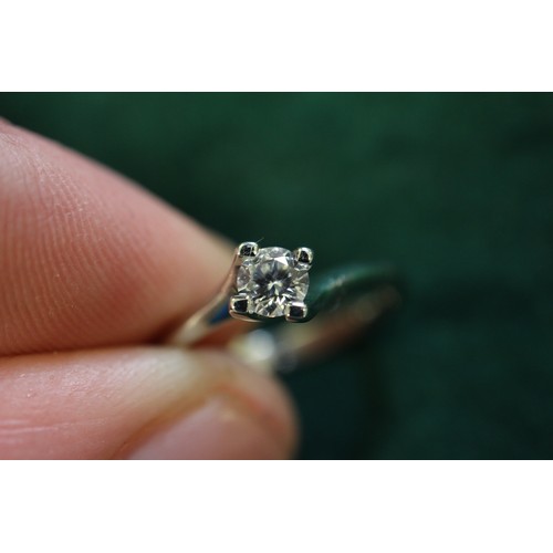 391 - A platinum and diamond solitaire ring, 0.2cts approx, size K, 3g