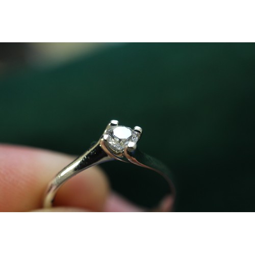 391 - A platinum and diamond solitaire ring, 0.2cts approx, size K, 3g