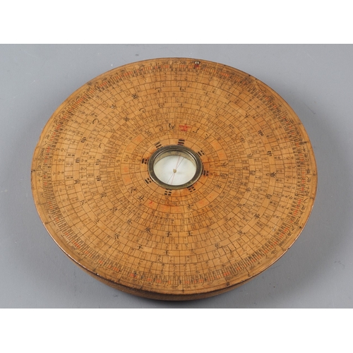 107 - A Chinese circular turned hardwood compass, 7 1/2