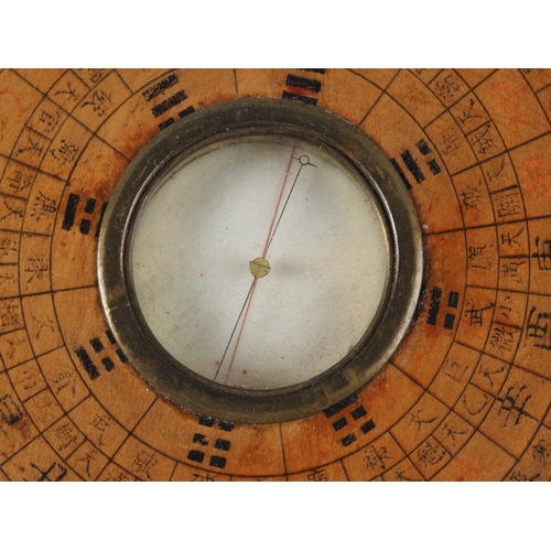107 - A Chinese circular turned hardwood compass, 7 1/2