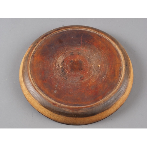 107 - A Chinese circular turned hardwood compass, 7 1/2