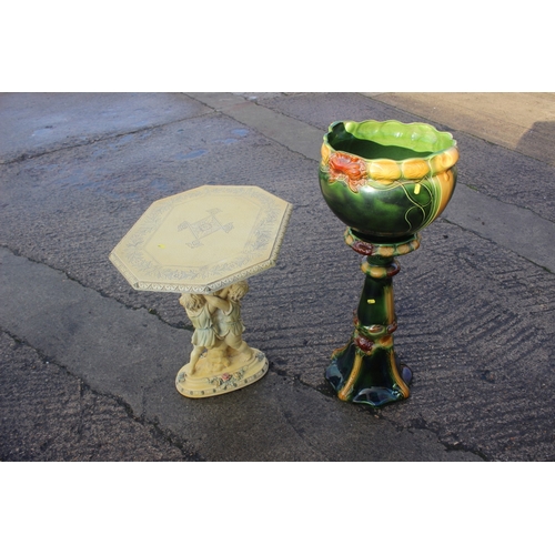 215 - A Victorian style green and cream glazed Majolica jardiniere on stand, 35