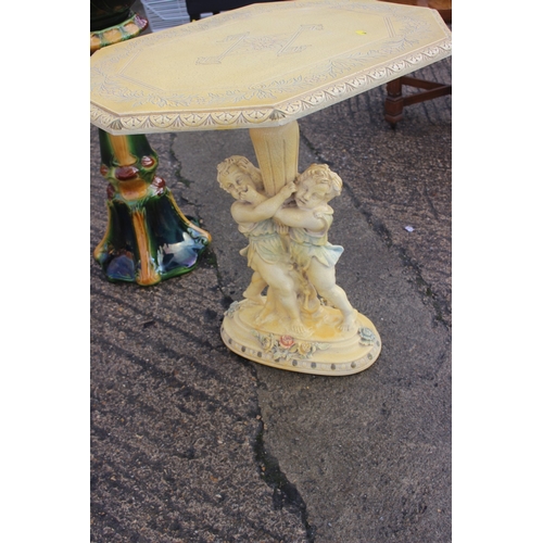 215 - A Victorian style green and cream glazed Majolica jardiniere on stand, 35